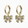 Aretes Huggies De Oro Moño Brillante Aretes Huggies De Oro Moño Brillante