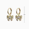Aretes Huggies De Oro Moño Brillante Aretes Huggies De Oro Moño Brillante