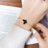 Pulsera De Acero Mariposa Negra Brillante Dorado Pulsera De Acero Mariposa Negra Brillante Dorado